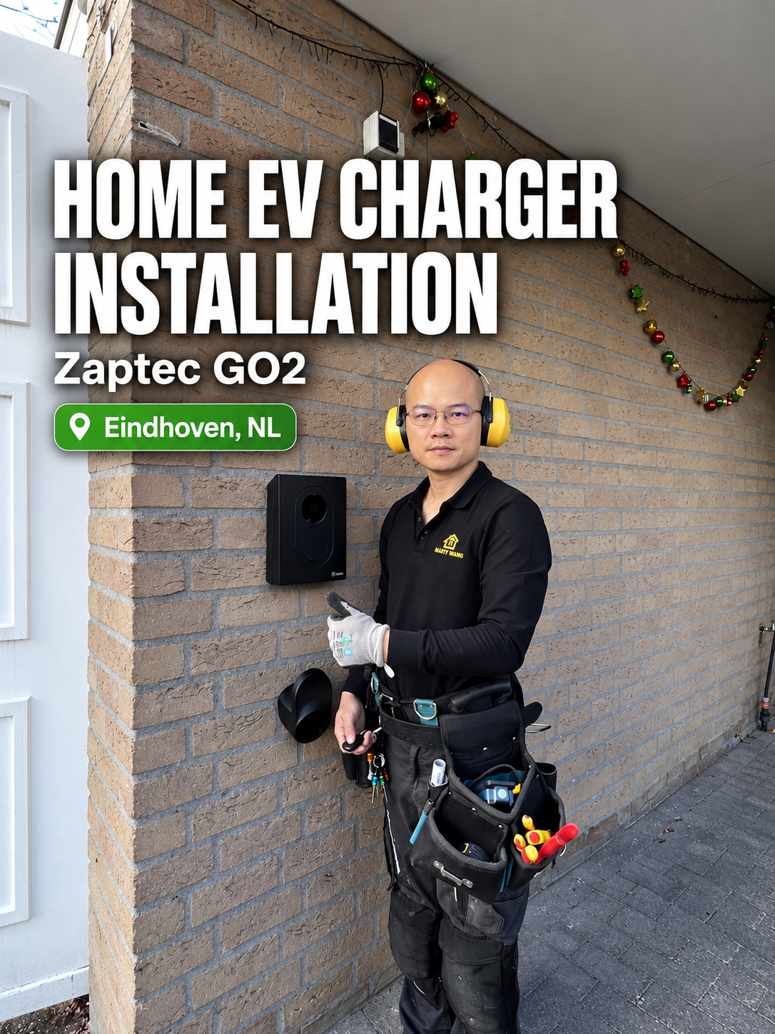 HandyWang installer beside a Zaptec Go 2 EV charger in Eindhoven